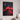The red moon canvas print hanging on the wall as bedroom decor.