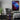 Chinatown acrylic-glass wall art hanging in a gaming room next to a computer setup as decor.