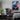 A gaming bedroom, featuring the retro space cybercity acrylic glass art as cool wall decor.
