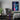 A gaming bedroom, featuring the Japanese anime wall art hanging on a wall, as gaming wall decor.