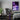 Purple city (Chicago-inspired) acrylic wall art hanging beside a gaming setup as room decor.