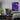 A gaming bedroom, featuring the Purple Dreams fantasy canvas hanging as wall decor.